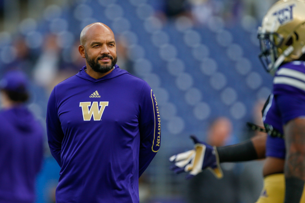 Oct 16, 2021; Seattle, Washington, USA; Washington Huskies head coach Jimmy Lake watches pregame warmups against the UCLA Bruins at Alaska Airlines Field at Husky Stadium. 